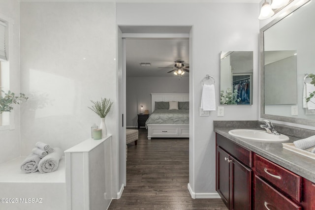 8751 W Saguaro Moon Rd, Marana, AZ 85653 - full bath featuring vanity, ceiling fan, connected bathroom, and wood finished floors