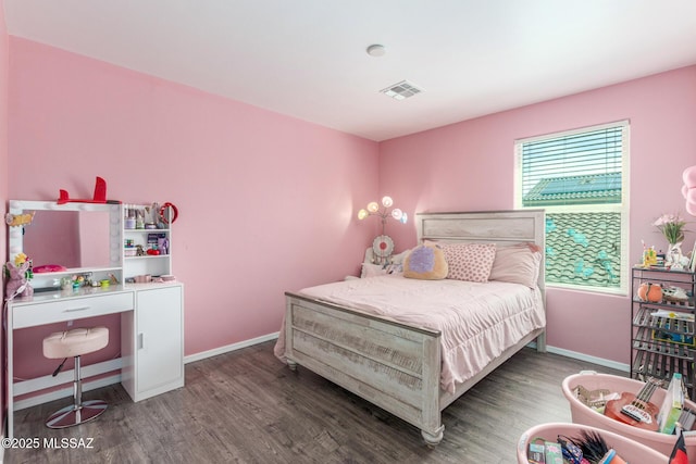 8751 W Saguaro Moon Rd, Marana, AZ 85653 - bedroom with wood finished floors and baseboards