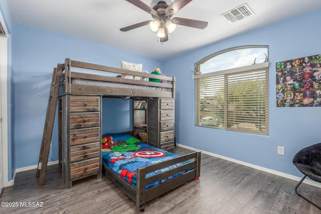 8751 W Saguaro Moon Rd, Marana, AZ 85653 - bedroom with wood finished floors, baseboards, and a ceiling fan