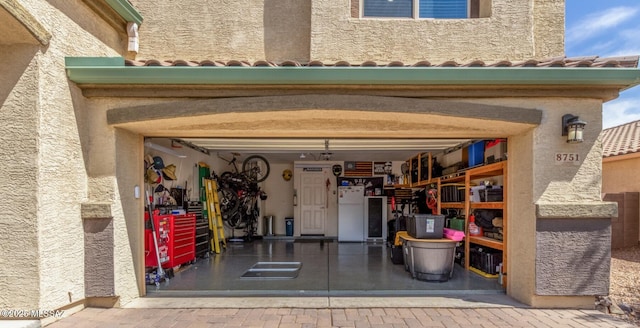 8751 W Saguaro Moon Rd, Marana, AZ 85653 - garage with freestanding refrigerator