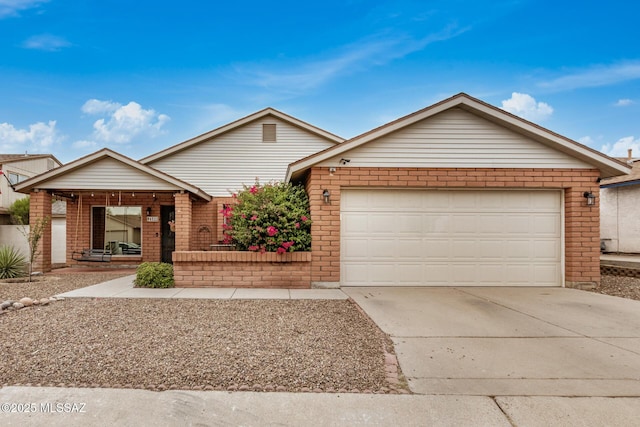 4522 W Vander Bie Pl, Tucson, AZ 85741 - single story home with brick siding, concrete driveway, and an attached garage