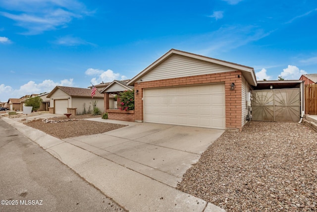 4522 W Vander Bie Pl, Tucson, AZ 85741 - single story home featuring an attached garage, brick siding, and driveway