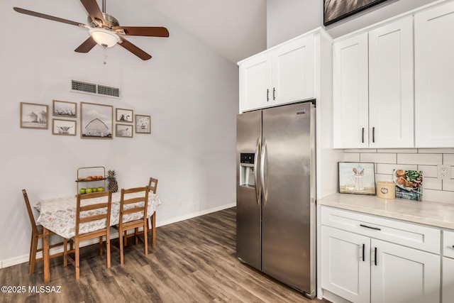 4522 W Vander Bie Pl, Tucson, AZ 85741 - kitchen with stainless steel refrigerator with ice dispenser, a ceiling fan, dark wood-type flooring, decorative backsplash, and white cabinets