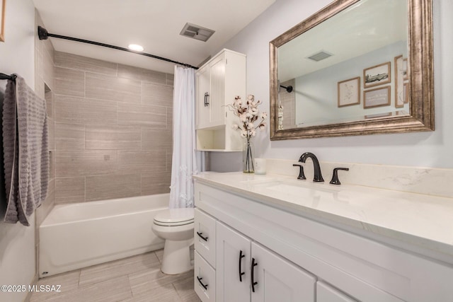 4522 W Vander Bie Pl, Tucson, AZ 85741 - bathroom featuring vanity, shower / bath combo with shower curtain, toilet, and recessed lighting