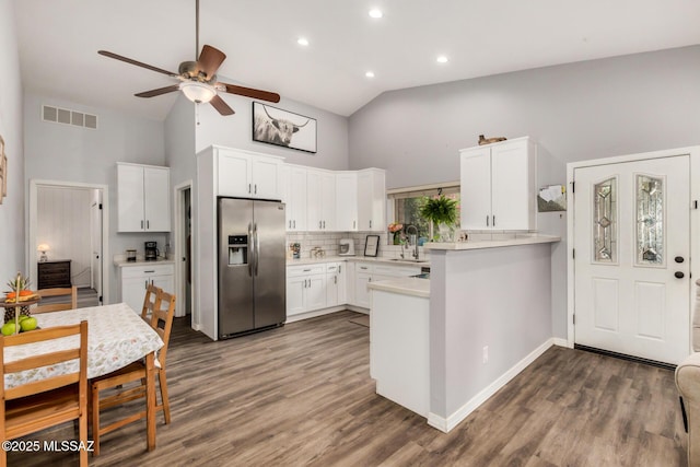 4522 W Vander Bie Pl, Tucson, AZ 85741 - kitchen with stainless steel refrigerator with ice dispenser, high vaulted ceiling, a ceiling fan, a peninsula, and light countertops