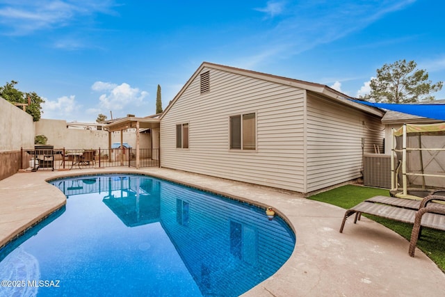 4522 W Vander Bie Pl, Tucson, AZ 85741 - view of swimming pool with a patio area and central AC