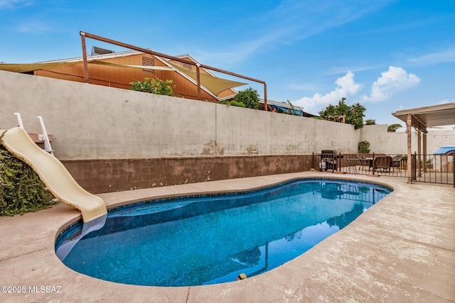 4522 W Vander Bie Pl, Tucson, AZ 85741 - view of swimming pool with a water slide and a patio
