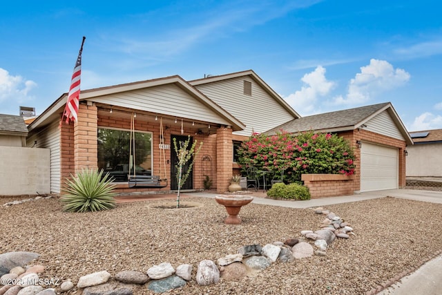 4522 W Vander Bie Pl, Tucson, AZ 85741 - ranch-style home featuring brick siding, an attached garage, and driveway