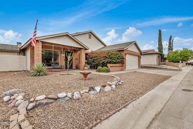 4522 W Vander Bie Pl, Tucson, AZ 85741 - view of front of property with brick siding, driveway, and an attached garage