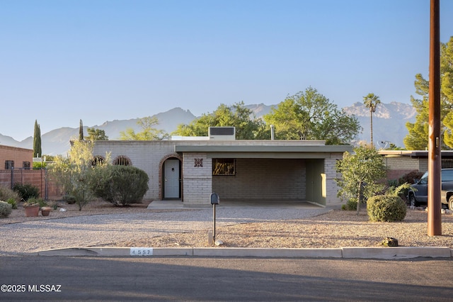 4557 E San Francisco Blvd, Tucson, AZ 85712 - mid-century modern home featuring a mountain view and brick siding