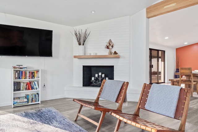 835 E Camino De Fray Marcos, Tucson, AZ 85718 - living area featuring wood finished floors, a fireplace, baseboards, recessed lighting, and vaulted ceiling