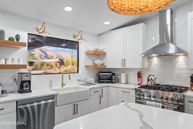 835 E Camino De Fray Marcos, Tucson, AZ 85718 - kitchen featuring stainless steel appliances, open shelves, wall chimney range hood, backsplash, and recessed lighting