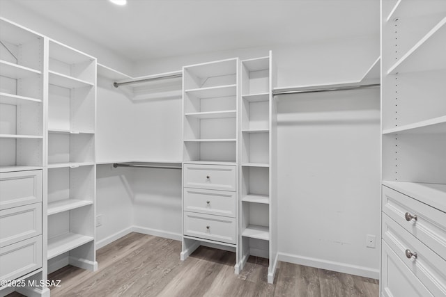835 E Camino De Fray Marcos, Tucson, AZ 85718 - spacious closet featuring wood finished floors
