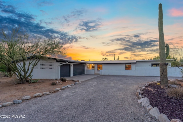 835 E Camino De Fray Marcos, Tucson, AZ 85718 - mid-century home featuring an attached garage and driveway