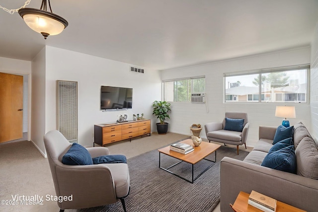 1470 S Palo Verde Ave Unit J 201, Tucson, AZ 85713 - carpeted living room featuring a heating unit and cooling unit