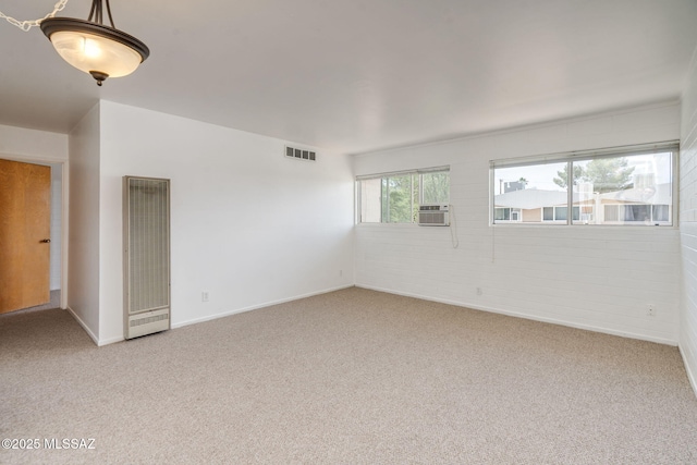1470 S Palo Verde Ave Unit J 201, Tucson, AZ 85713 - empty room with a heating unit, light carpet, baseboards, and cooling unit
