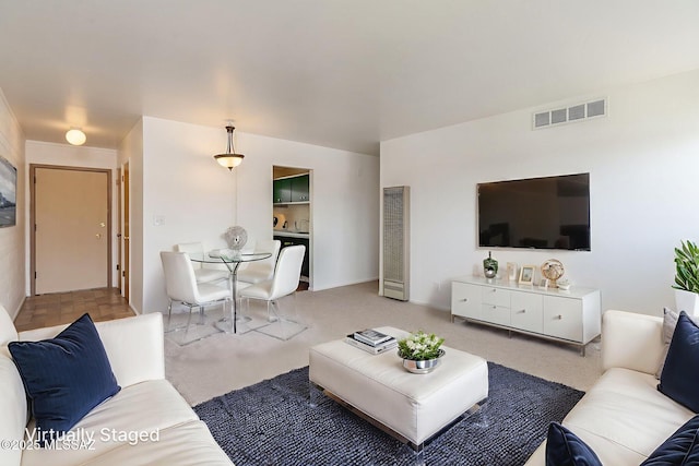1470 S Palo Verde Ave Unit J 201, Tucson, AZ 85713 - carpeted living area with a heating unit and baseboards