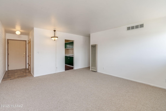 1470 S Palo Verde Ave Unit J 201, Tucson, AZ 85713 - carpeted spare room with a heating unit and baseboards