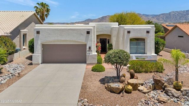 37671 S Hill Side Dr, Tucson, AZ 85739 - adobe home with a mountain view, a garage, driveway, and stucco siding