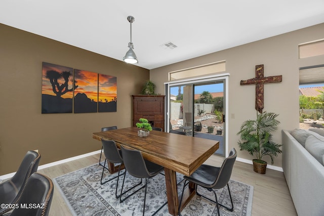 37671 S Hill Side Dr, Tucson, AZ 85739 - dining room featuring light wood-type flooring and baseboards