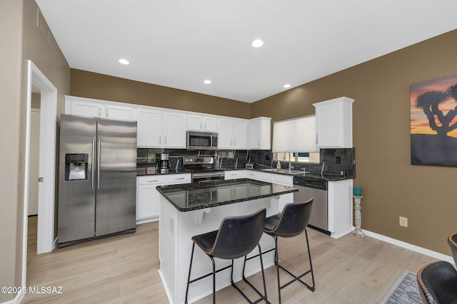 37671 S Hill Side Dr, Tucson, AZ 85739 - kitchen with appliances with stainless steel finishes, a sink, tasteful backsplash, white cabinetry, and recessed lighting