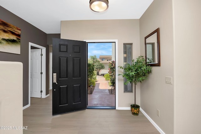 37671 S Hill Side Dr, Tucson, AZ 85739 - entrance foyer with light wood-style floors and baseboards