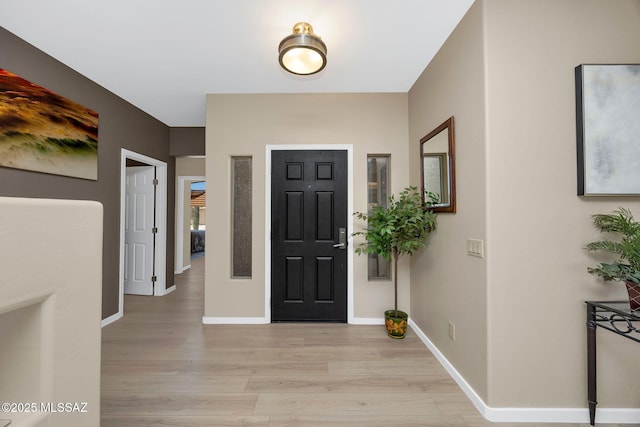 37671 S Hill Side Dr, Tucson, AZ 85739 - entrance foyer with light wood-style floors and baseboards