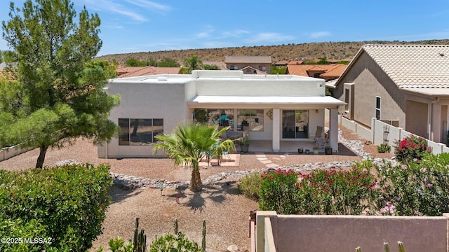 37671 S Hill Side Dr, Tucson, AZ 85739 - rear view of house featuring stucco siding, a patio area, and a mountain view