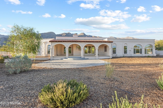 6355 N Camino De Santa Valera, Tucson, AZ 85718 - back of property with a mountain view, a porch, and a chimney