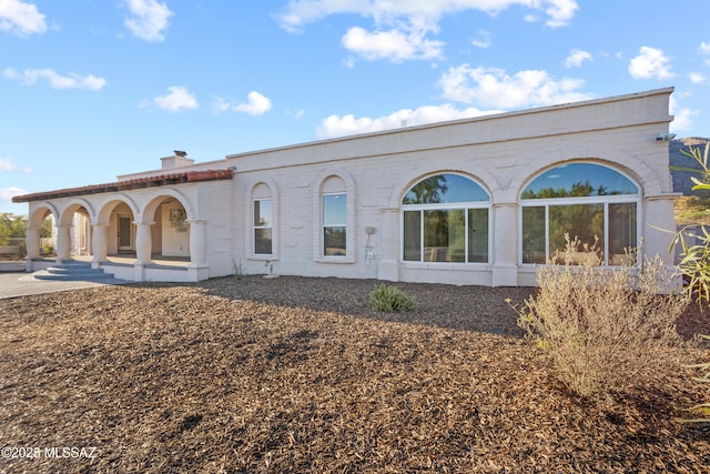 6355 N Camino De Santa Valera, Tucson, AZ 85718 - view of front facade with covered porch and a chimney