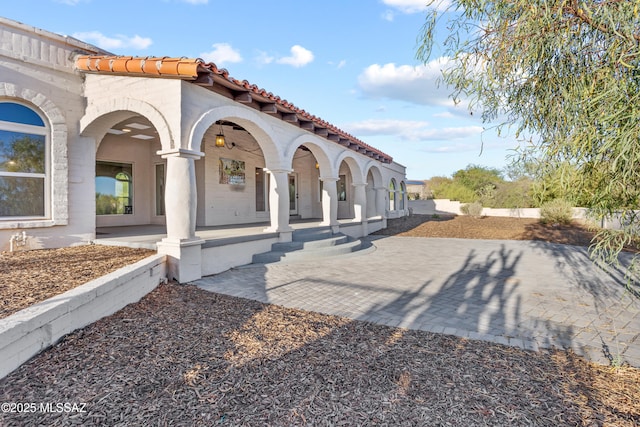 6355 N Camino De Santa Valera, Tucson, AZ 85718 - back of property with a tiled roof, covered porch, and stucco siding