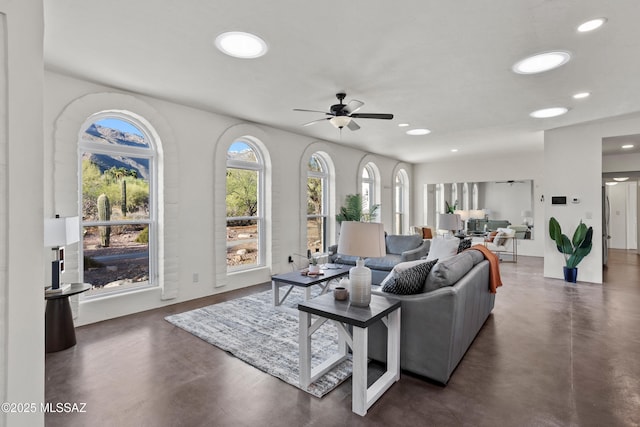 6355 N Camino De Santa Valera, Tucson, AZ 85718 - living room with concrete flooring, ceiling fan, and recessed lighting