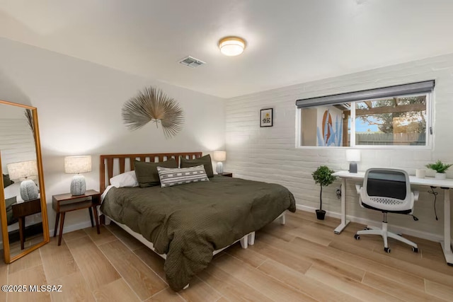 5601 E Baker St, Tucson, AZ 85711 - bedroom featuring light wood-style flooring, an office area, and baseboards