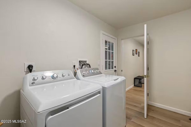 5601 E Baker St, Tucson, AZ 85711 - laundry area featuring washing machine and clothes dryer, light wood-style floors, and baseboards