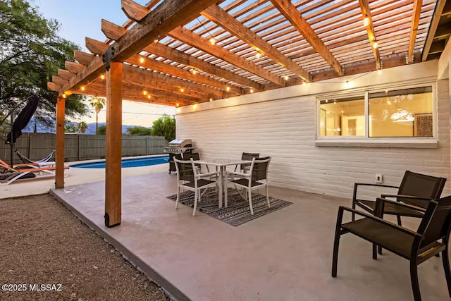 5601 E Baker St, Tucson, AZ 85711 - fenced backyard with a patio area, area for grilling, a pergola, and outdoor dining space