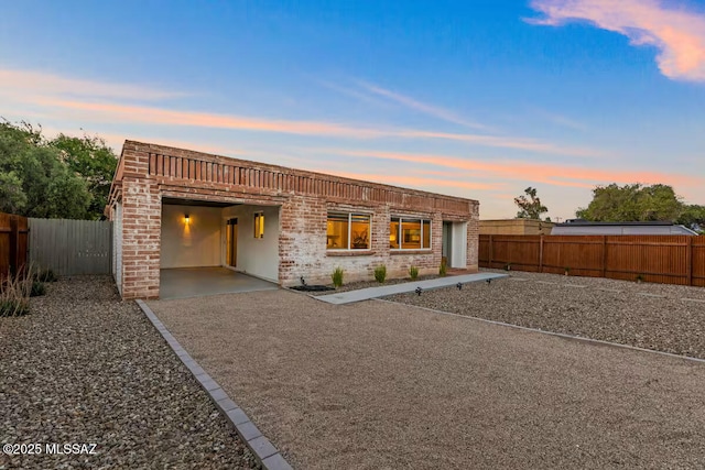 5601 E Baker St, Tucson, AZ 85711 - view of front of home featuring a fenced backyard and brick siding