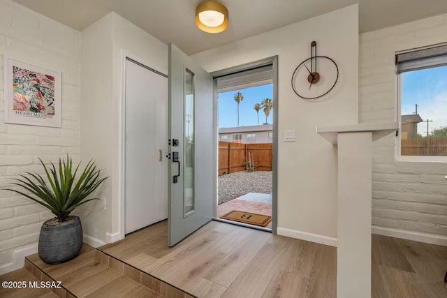 5601 E Baker St, Tucson, AZ 85711 - foyer entrance with baseboards and light wood-style floors