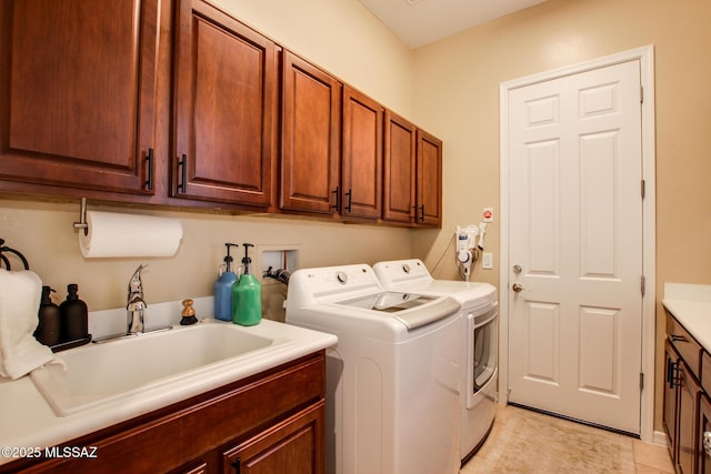 5457 S Canyon Oak Dr, Tucson, AZ 85747 - laundry room with cabinet space, washing machine and clothes dryer, and light tile patterned floors