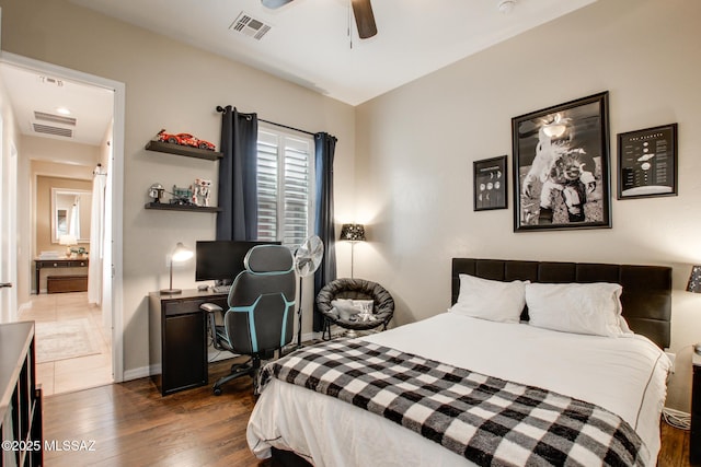 5457 S Canyon Oak Dr, Tucson, AZ 85747 - bedroom with wood finished floors, ceiling fan, baseboards, and a desk