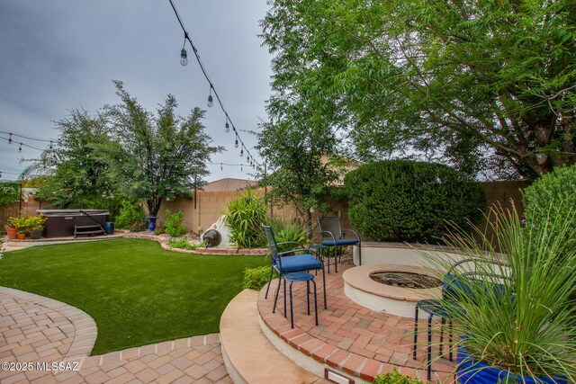 5457 S Canyon Oak Dr, Tucson, AZ 85747 - view of patio featuring a hot tub and a fire pit