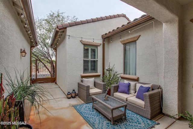 5457 S Canyon Oak Dr, Tucson, AZ 85747 - view of patio / terrace featuring a gate and an outdoor living space