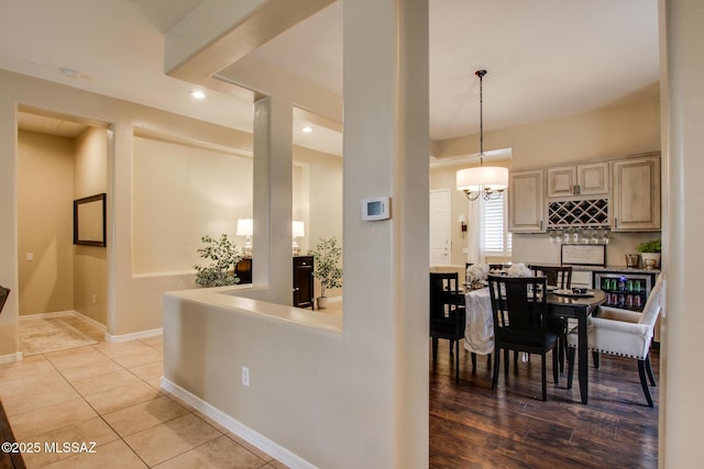 5457 S Canyon Oak Dr, Tucson, AZ 85747 - dining room featuring baseboards, recessed lighting, light tile patterned flooring, a chandelier, and bar
