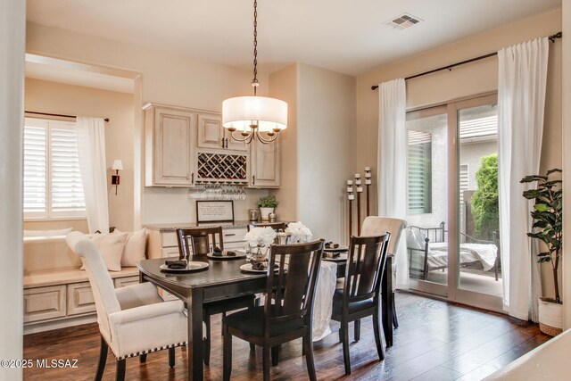 5457 S Canyon Oak Dr, Tucson, AZ 85747 - dining area with dark wood-style floors and a chandelier