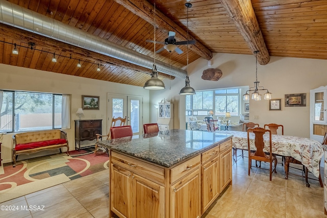 11569 E Speedway Blvd, Tucson, AZ 85748 - kitchen with wood ceiling, a kitchen island, dark stone counters, ceiling fan, and hanging light fixtures