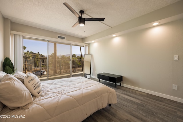 425 W Paseo Redondo Unit 3D, Tucson, AZ 85701 - bedroom featuring a textured ceiling, dark wood-type flooring, baseboards, recessed lighting, and a ceiling fan