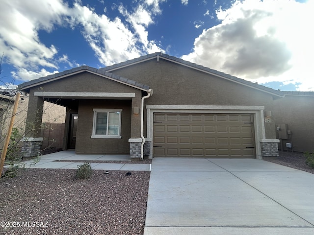 21945 E Wayward Ln, Red Rock, AZ 85145 - view of front of property with an attached garage, concrete driveway, and stucco siding