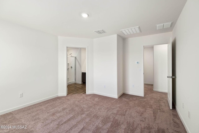 21984 E Wayward Ln, Red Rock, AZ 85145 - unfurnished bedroom featuring carpet flooring, baseboards, and connected bathroom