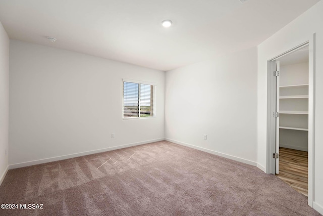 21903 E Wayward Ln, Red Rock, AZ 85145 - unfurnished bedroom featuring carpet flooring and a spacious closet