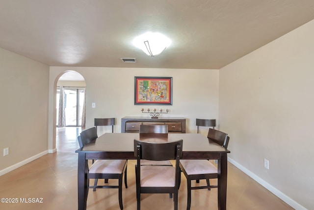 2435 N Shade Tree Cir, Tucson, AZ 85715 - dining area featuring arched walkways and baseboards