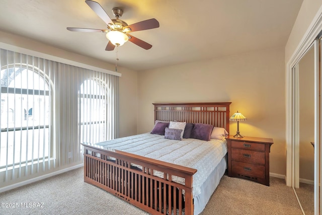 2435 N Shade Tree Cir, Tucson, AZ 85715 - carpeted bedroom featuring baseboards and a ceiling fan